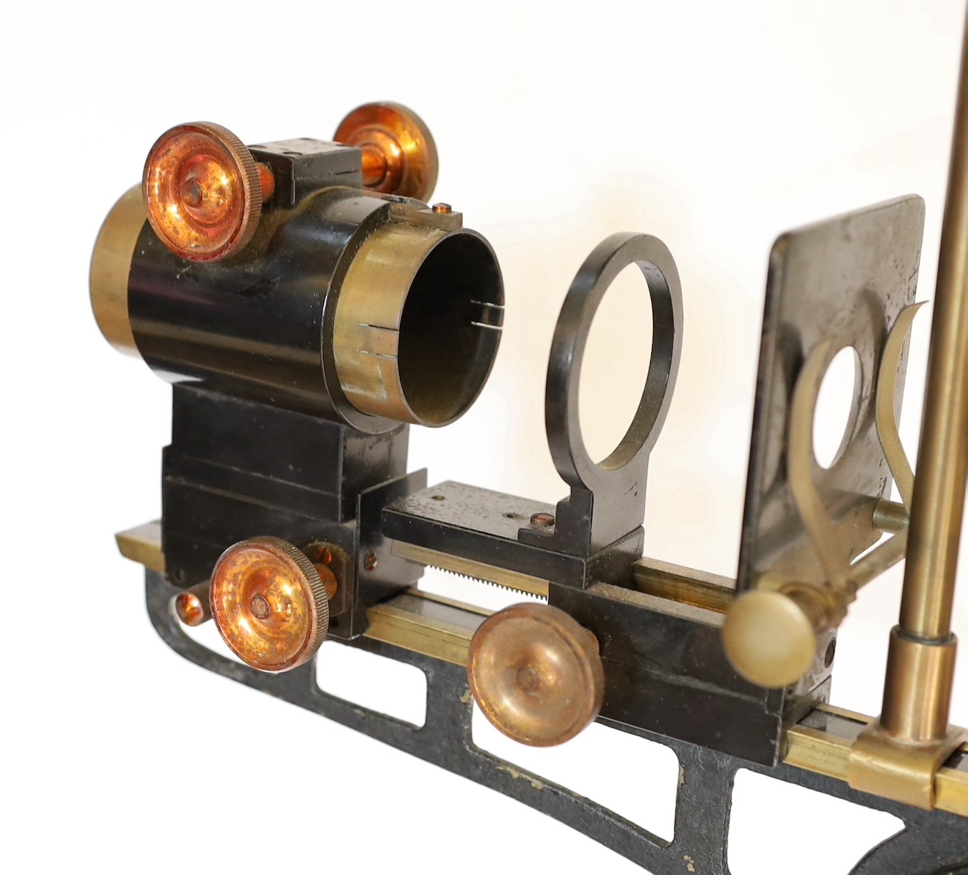 An early 20th century Hatters & Garnett Ltd black lacquered and brass microscope slide projector table lamp (conversion), height 57cm